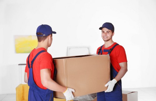 Local team managing office furniture loading and transport