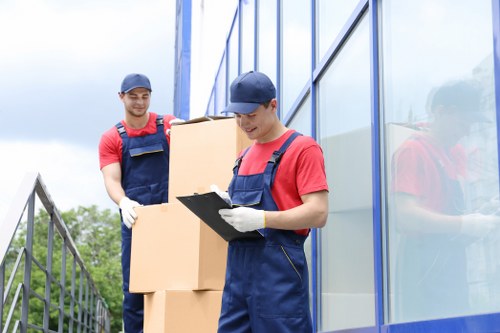 Moving team handling boxes safely during a removal service
