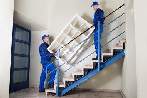 Moving team handling a house move in a Bexley street