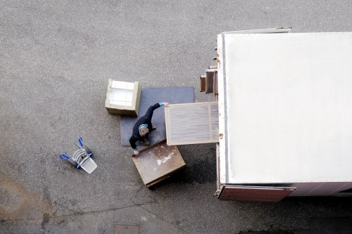 Removal team handling a house move in a Bexley residential street