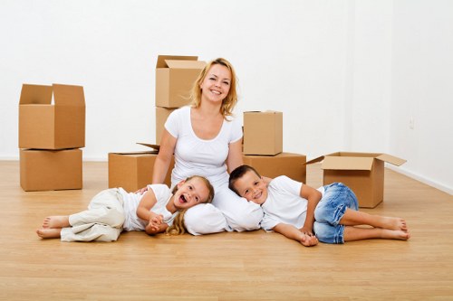 Removal van and movers handling household goods carefully