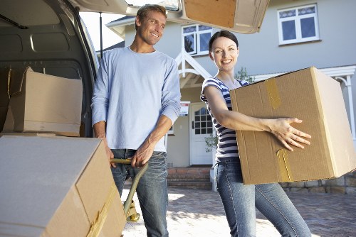 Packed moving boxes and furniture prepared for transport
